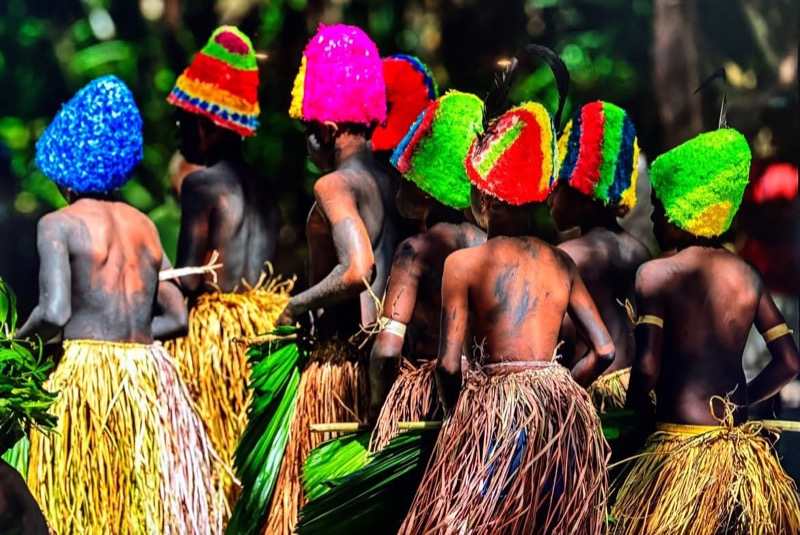 Dancers in traditional ceremonial dress performing a Torres Islands cultural dance