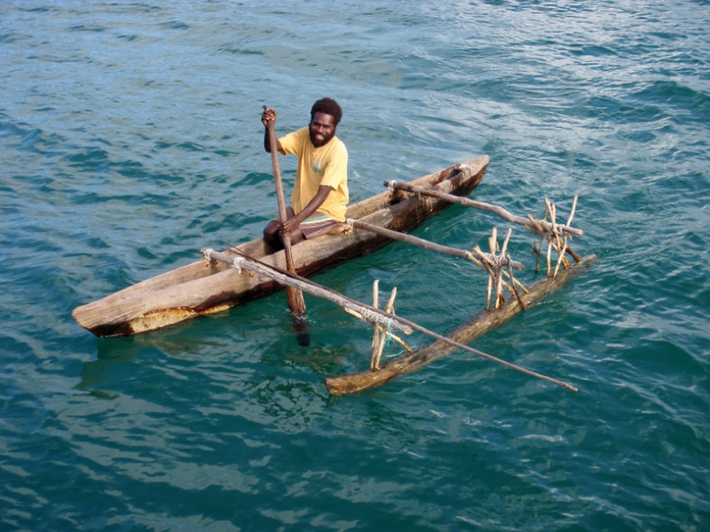 Guide fishing from a traditional outrigger canoe