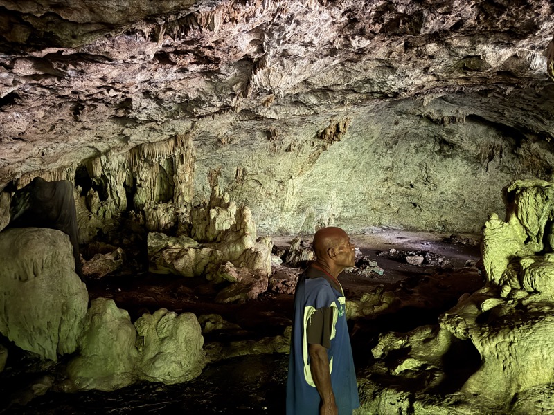 Guide inside the Loh evacuation center cave dwelling site